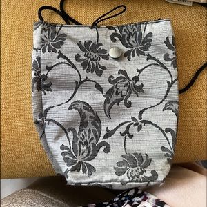 Soft silky (inside) and out. Grey and black bag